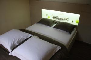 Letto o letti in una camera di B&B Au coin des sources
