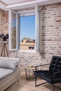 Posezení v ubytování Vailato Loft Suites