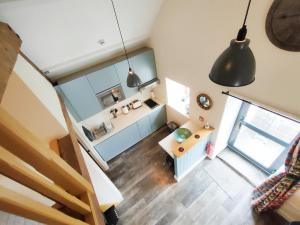 an overhead view of a living room with a desk at Captains Lookout (Studio apartment) in Brecon