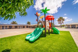 a playground with slides in a park at Carnarvon Motel in Carnarvon