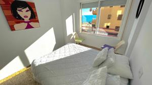 Ein Bett oder Betten in einem Zimmer der Unterkunft Liberty 4 personas Calpe centro