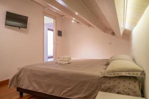 Säng eller sängar i ett rum på Il Duomo-Cefalù Holiday Apartments