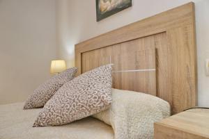 A bed or beds in a room at Apartamento Cortes