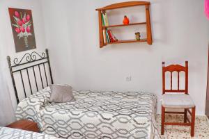 A bed or beds in a room at Apartamento Cortes
