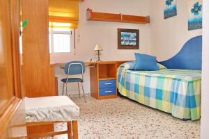 A bed or beds in a room at Apartamento Cortes
