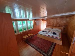 a bedroom in a boat with a bed in it at FeWo aletsch dreams in Fiesch