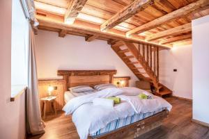 Posteľ alebo postele v izbe v ubytovaní Chalet Osmar Appartamento 2