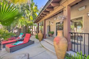 a patio with three large vases on a house at Bright Poway Studio with Shared Outdoor Oasis! in Poway