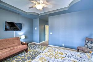 a living room with a bed and a couch at Grand Hot Springs Home Less Than 5 Mi to Lake Desoto! in Hot Springs Village