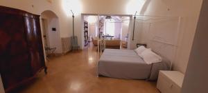 Postel nebo postele na pokoji v ubytování Palazzo Bernardini B & B