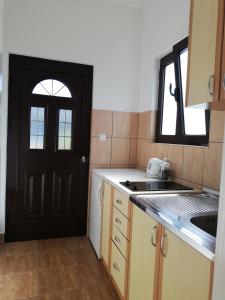 Kuchyň nebo kuchyňský kout v ubytování Apartmani Vidakovic