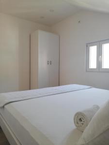 Postel nebo postele na pokoji v ubytování Apartmani Vidakovic