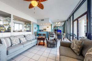 a living room with a couch and a table at Sunchase IV in South Padre Island