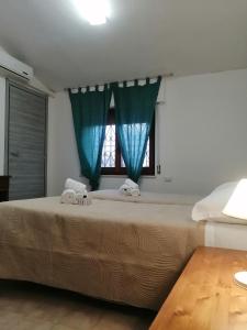 Postel nebo postele na pokoji v ubytování Hotel Soleo