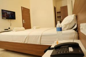 Postel nebo postele na pokoji v ubytování Hotel Amoha