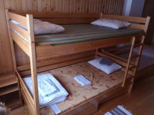 a bunk bed in a cabin with two pillows at Karak Apartman in Harghita-Băi +27 photos