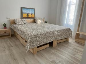 Posteľ alebo postele v izbe v ubytovaní Alzira bonita Apartamento D junto a Plaza Mayor, Santa Catalina