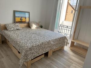 Posteľ alebo postele v izbe v ubytovaní Alzira bonita Apartamento D junto a Plaza Mayor, Santa Catalina