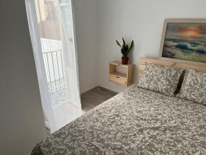 Posteľ alebo postele v izbe v ubytovaní Alzira bonita Apartamento D junto a Plaza Mayor, Santa Catalina