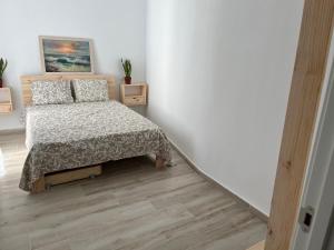Posteľ alebo postele v izbe v ubytovaní Alzira bonita Apartamento D junto a Plaza Mayor, Santa Catalina
