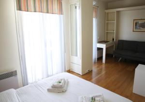 A bed or beds in a room at Penthouse -Breathtaking sea view-Just on the beach