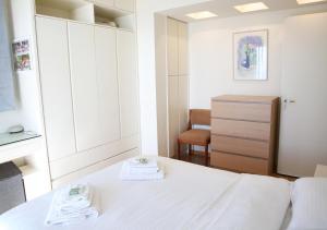 A bed or beds in a room at Penthouse -Breathtaking sea view-Just on the beach