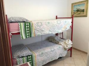 Ένα ή περισσότερα κρεβάτια σε δωμάτιο στο Brezza Marina