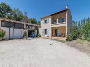 a large house with a driveway in front of it at Superb house with pool near the Luberon in Oppède