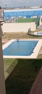 a swimming pool in the middle of a building at Apartamento Fibes y Congresos in Seville