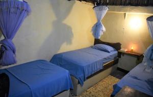 Postel nebo postele na pokoji v ubytování Hotel El Delfin