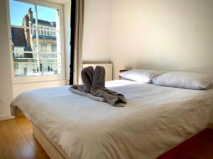 Krevet ili kreveti u jedinici u objektu Les Fabuleux appartements du Coeur de ville - Place Victor Hugo
