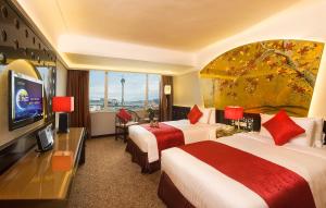 Televiisor ja/või meelelahutuskeskus majutusasutuses Hotel Riviera Macau