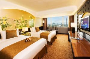 Televiisor ja/või meelelahutuskeskus majutusasutuses Hotel Riviera Macau