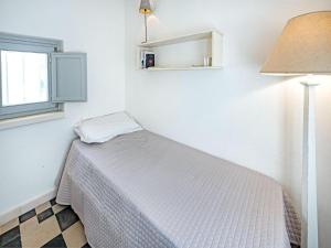 A bed or beds in a room at Trulli di Montepizzuto