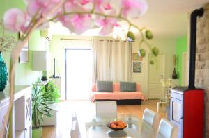 a living room with a table and a couch at Apartments Vodanović in Podgora