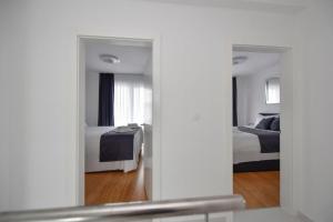 Łóżko lub łóżka w pokoju w obiekcie Apartman Bora 1