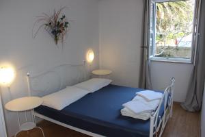 Postel nebo postele na pokoji v ubytování Apartments Blue Sea