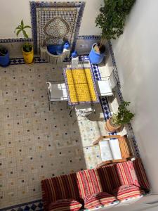 an overhead view of a table and chairs with plants at House Zitouna in Marrakesh