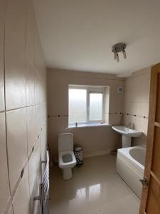 a bathroom with a toilet and a sink at 2BR 15 min to BHX Airport 5 min to Heartlands in Birmingham