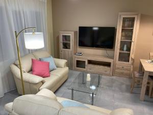 Televízia a/alebo spoločenská miestnosť v ubytovaní CERES Home