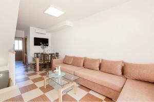 a living room with a couch and a table at Apartamento, Casa, Chalet Adosado FRENTE AL MAR in Carboneras