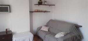 a living room with a couch and a tv at Nice terrace, 45 min from Barcelona and Port Aventura in Cunit