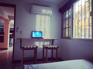 TV in/ali zabaviščno središče v nastanitvi Sundaze Homestay
