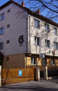 a building with a sign on the side of it at Corvin Hotel in Győr