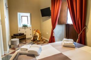 Posteľ alebo postele v izbe v ubytovaní TRESCA CHARME luxury Rooms