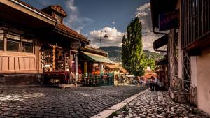 a cobble stone street in a town with buildings at Apartment Bascarsija in Sarajevo