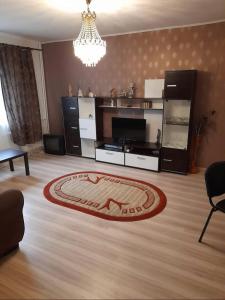 a living room with a rug on the floor at Ploiesti ultracentral !!! in Ploieşti