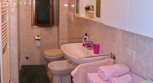 a bathroom with a sink and a toilet at La Casa Delle Rose in La Spezia