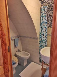 a bathroom with a toilet and a sink at MY CHARMING HOUSE - Luna apartment in Ravello