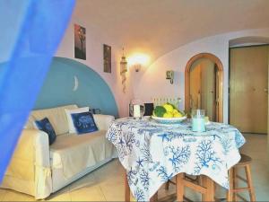 a living room with a table and a couch at MY CHARMING HOUSE - Luna apartment in Ravello